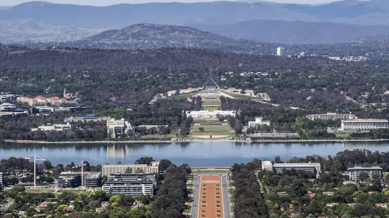 Landscape view of Canberra mountain, lake and city.