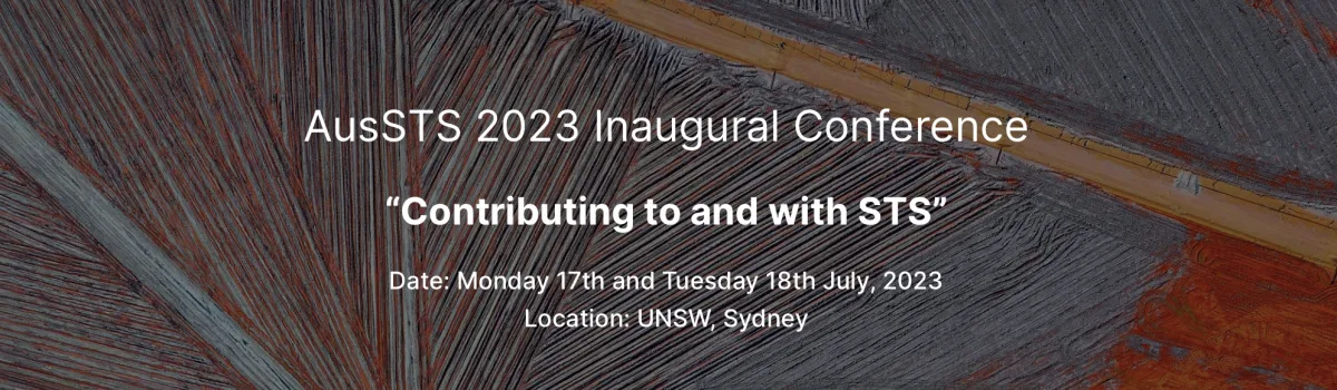Aerial view of a construction with orange, brown and grey colours. Text overlaid on top reads, AuSTS 2023 Inaugural Conference