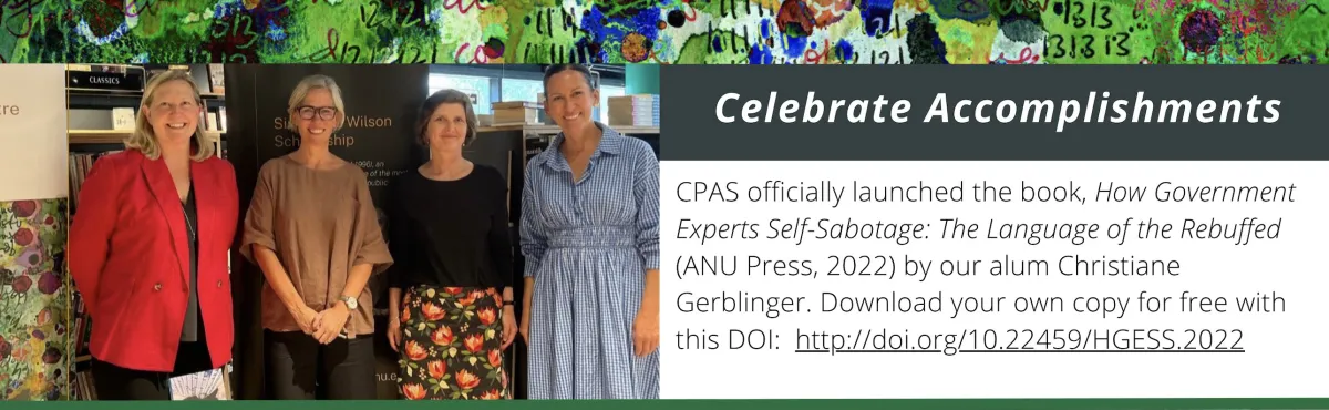 Four women standing for a photo together.