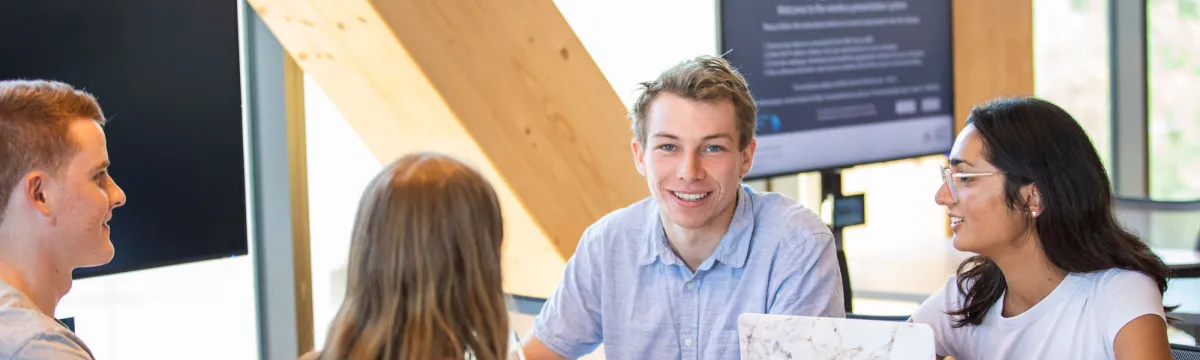 4 students sitting at a table