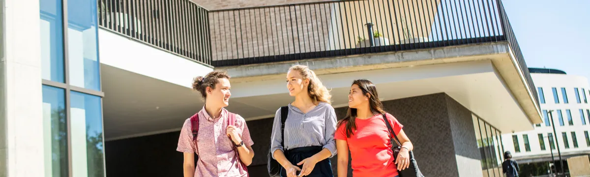 3 students walking