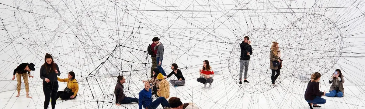 People connected by string.