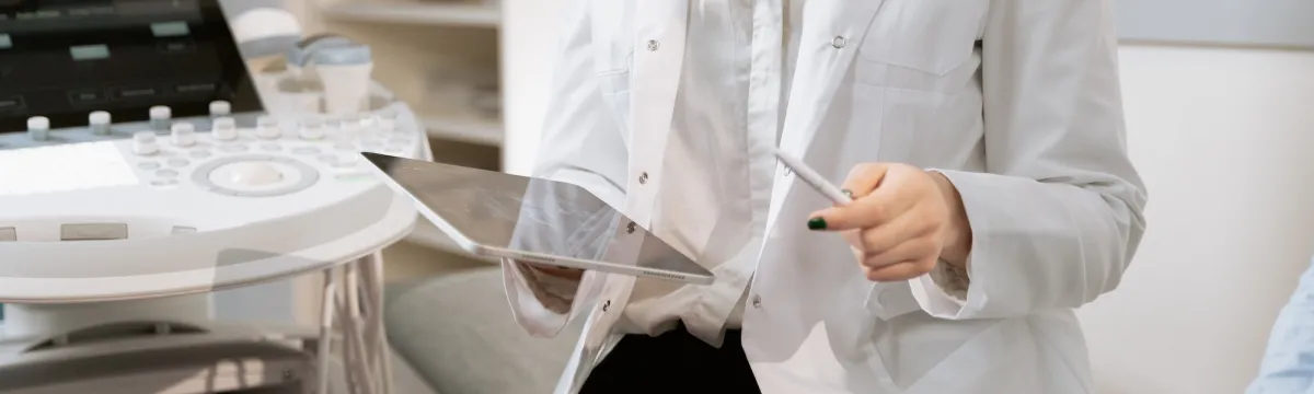 A doctor sitting near medical equipments
