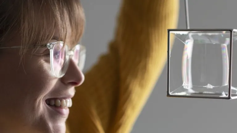 A lady looking at a bubble