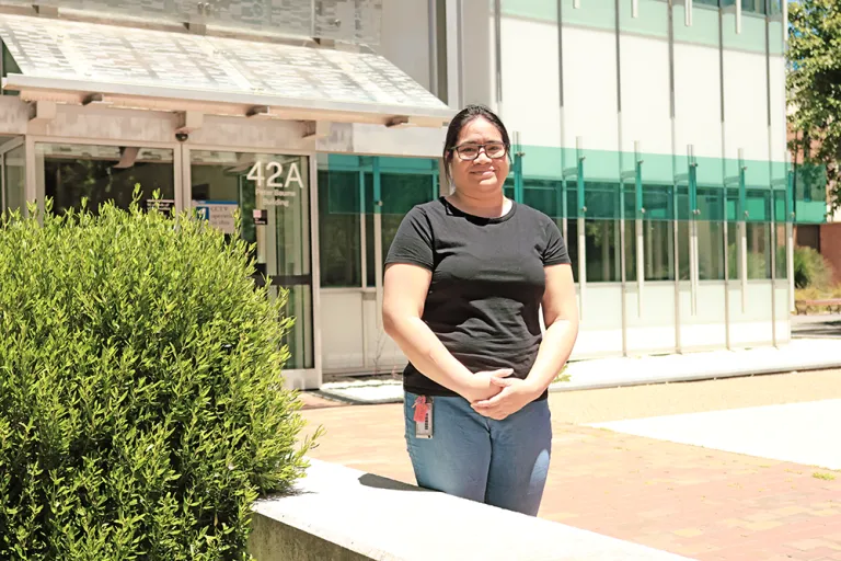 Jade Suaesi standing in front of the Peter Baume Building