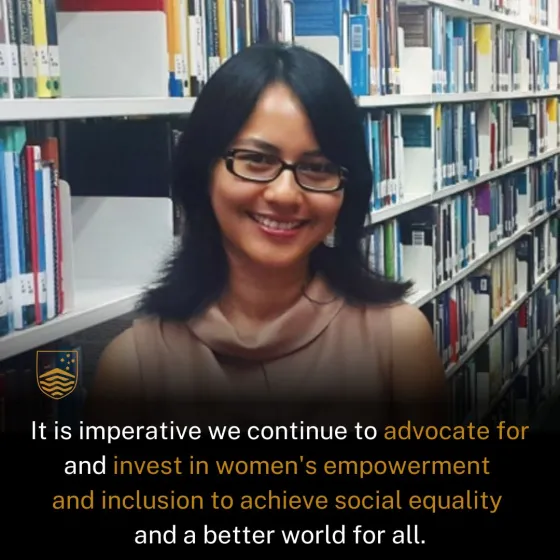Woman smiling in a library with a quote below.