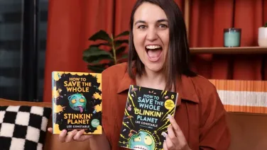 Lee Constable holding two books